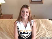 Dressed in a cheerleader outfit, eighteen year old Denice K. admits that babe is very nervous!