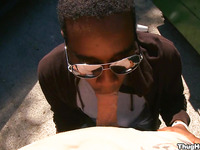 Black man in glasses making blowjob