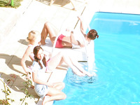 Three handsome and cute lesbians are having fun in the poolside