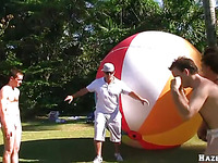 Naked horny guys are going wild and crazy over this huge ball